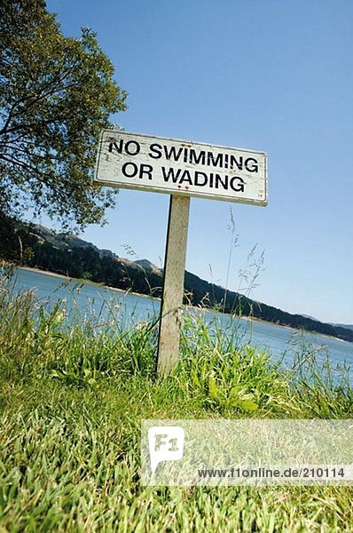 Sign by a lake