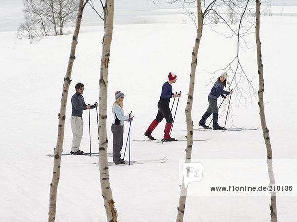 Skiers trekking through the snow