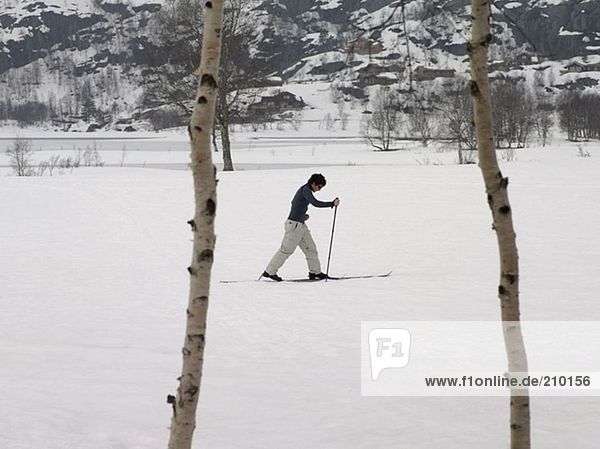 Skier trekking through snow