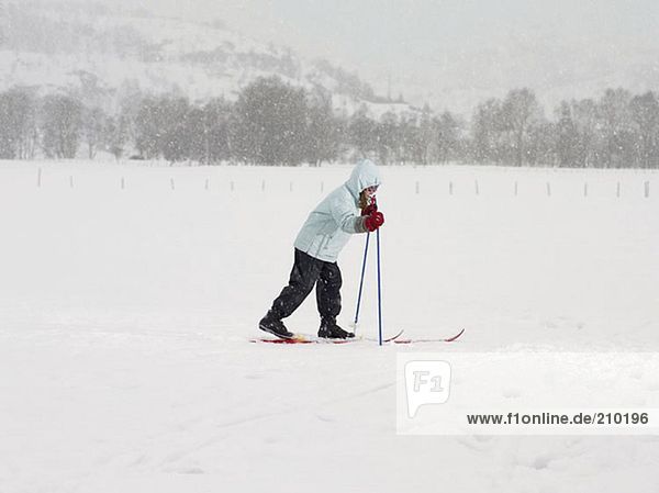Girl on skis walking in the snow