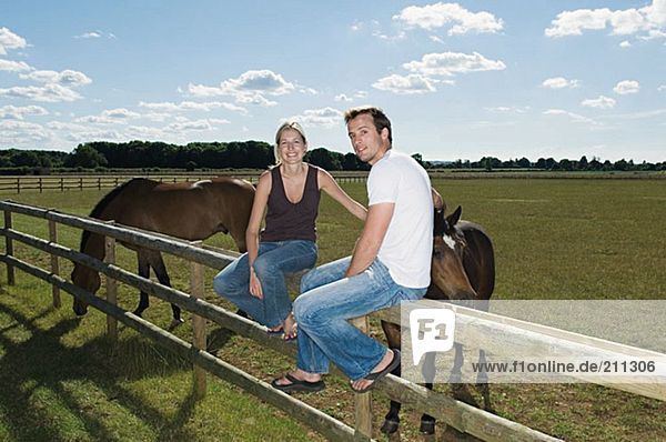 Couple with field of horses