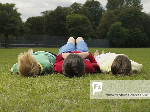 Children lying in the park