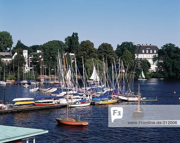 Boats moored at harbor  River Alster  Hamburg  Germany