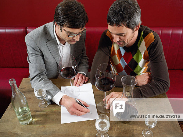 Two men at wine tasting