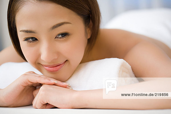 Smiling woman on massage table