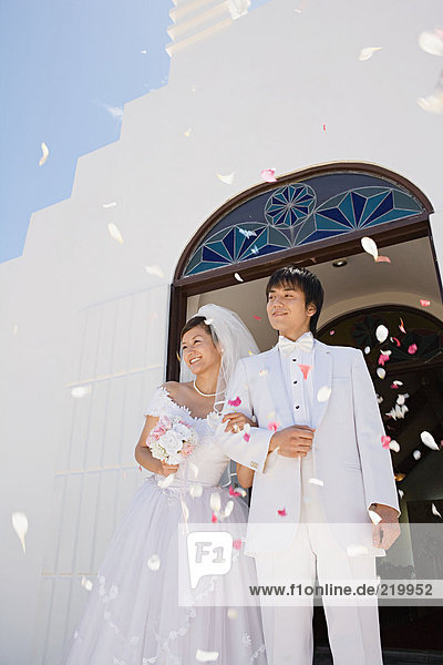 Confetti showering upon newlyweds