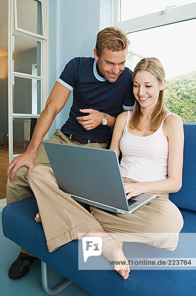 Couple using a laptop computer