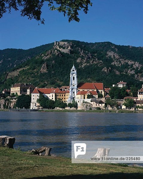 Town at waterfront with castle on hill in background  Duernstein Castle  Austria