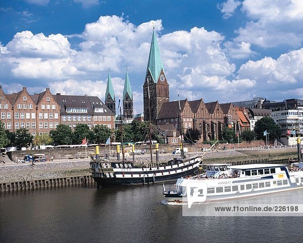Tour boat sailing through city in river  Bremen  Germany