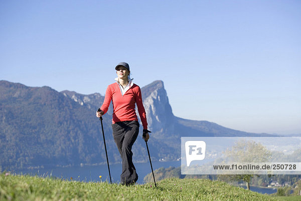 Woman exercising Nordic Walking  Austria  alps