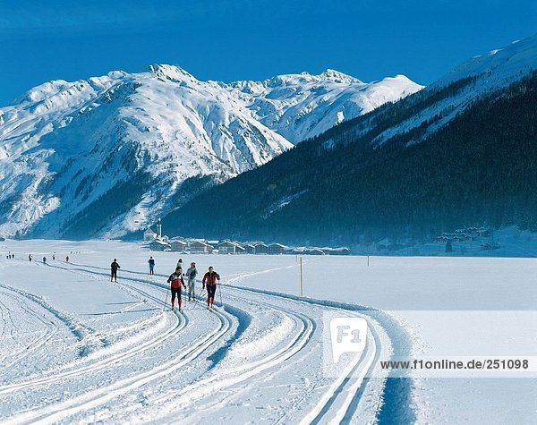 10007175  mountains  group  cross-country skiing  cross-country  skiing  cross-country trail  mountains  Alps  Switzerland  Eu