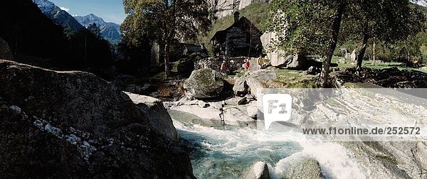 10481745  family  river  flow  mother  Rustici  Switzerland  Europe  Ticino  Val Calneggia  walking  hiking  two  children