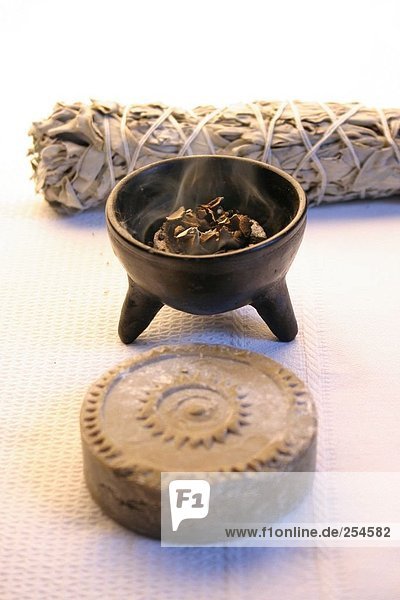 High angle view of burning incense in bowl