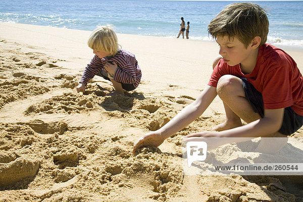 Portugal  Algarve  boys playing on beach