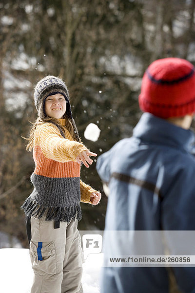 Austria  girl (8-9) throwing snowball