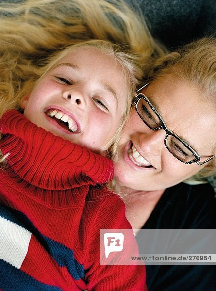 Laughing mother and daughter together.
