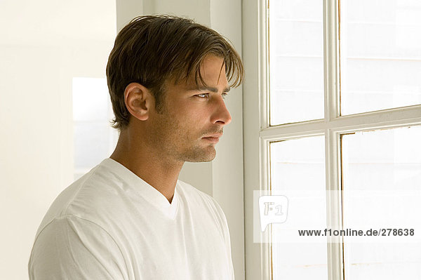 Man looking out of window