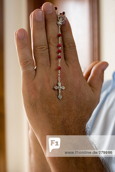 Man holding a rosary