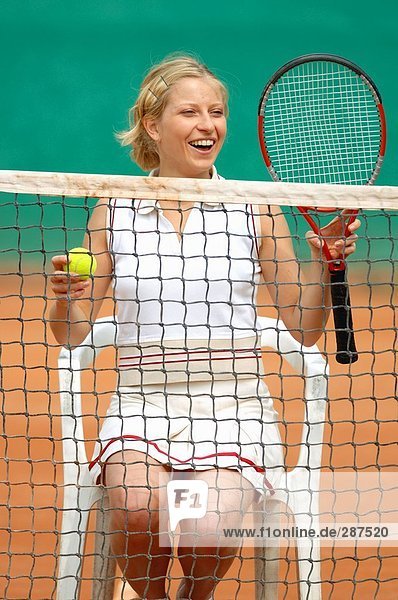 Weibliche Tennis Player sitzend