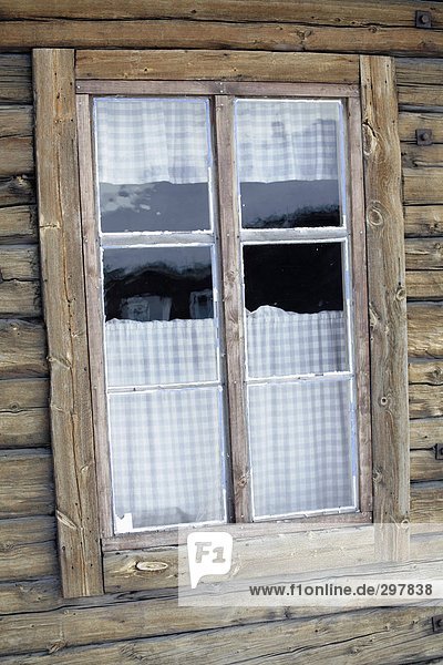 A window on a log house.