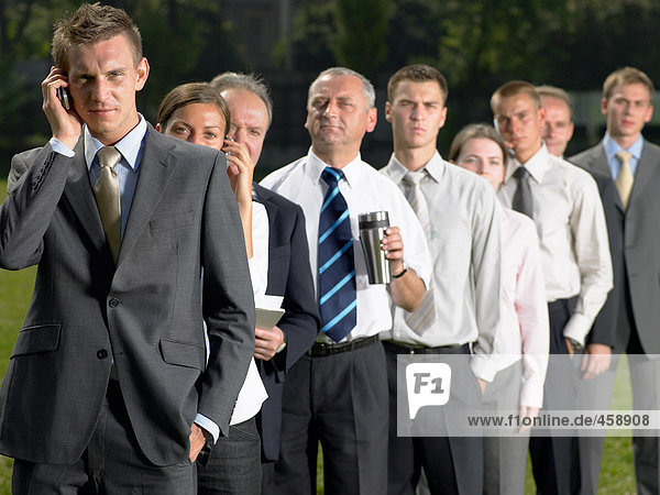 Businesspeople in a queue
