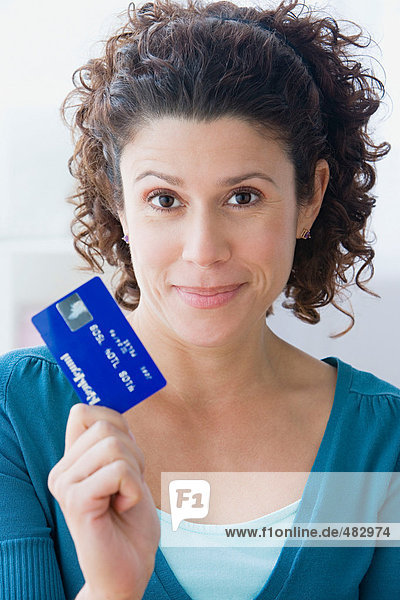 Woman holding a credit card