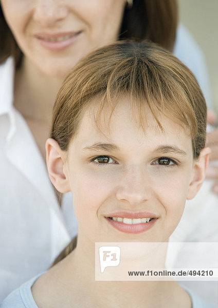 Girl with mother in background  portrait
