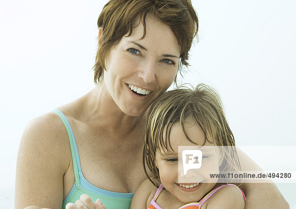Mother and daughter wearing swimsuits  portrait