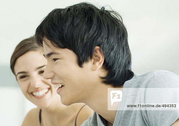 Young man and woman smiling