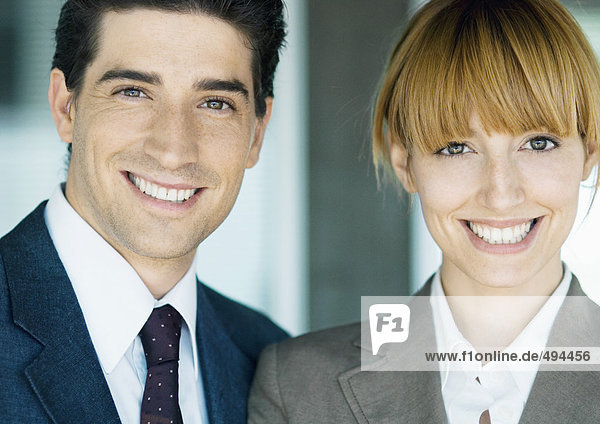 Business partners smiling at camera  portrait