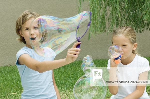 Girls making bubbles