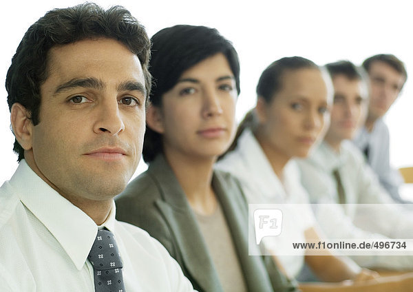 Business colleagues having meeting  focus on man in foreground