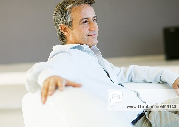 Man relaxing on sofa