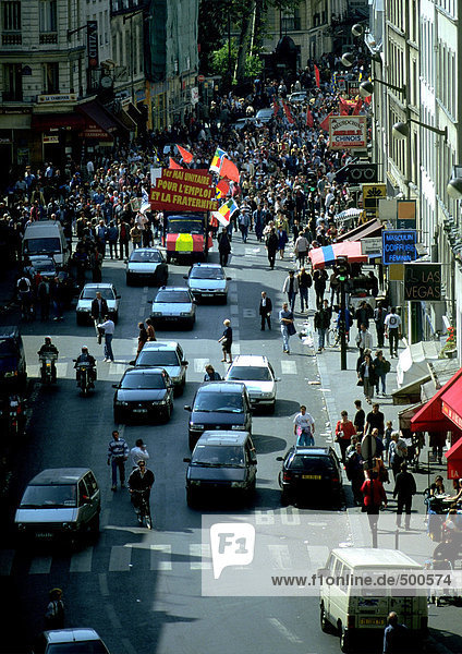 Crowd of people in street with banners