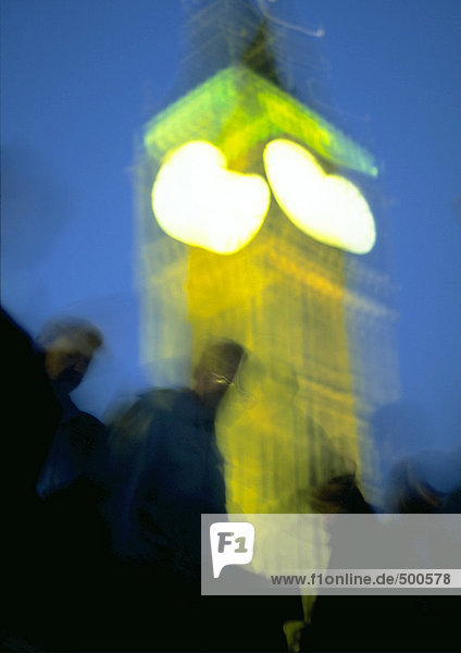 England  London  group of people in front of Big Ben at night  blurred