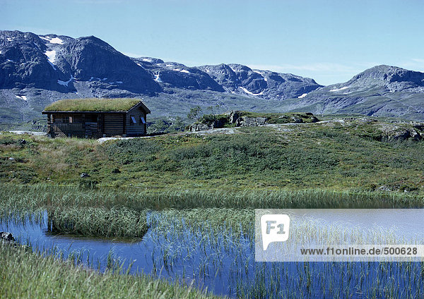 Scandinavia  log cabin in mountains