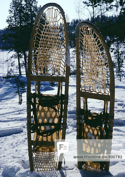 Sweden  snowshoes stuck into snow