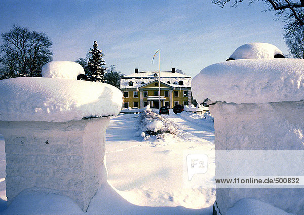 Sweden  mansion in snow in distance