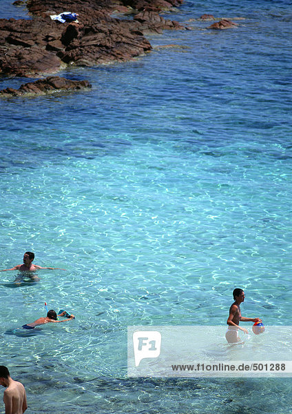 France  Corsica  people wading in sea