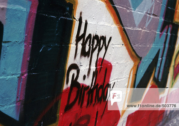 'Graffiti with ''Happy Birthday'' on wall'