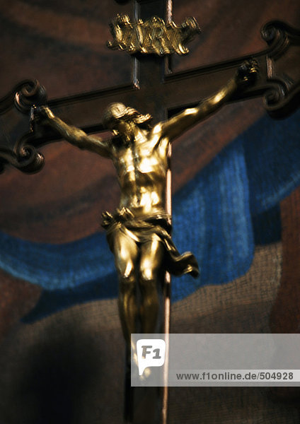 Gilded crucifixion statue