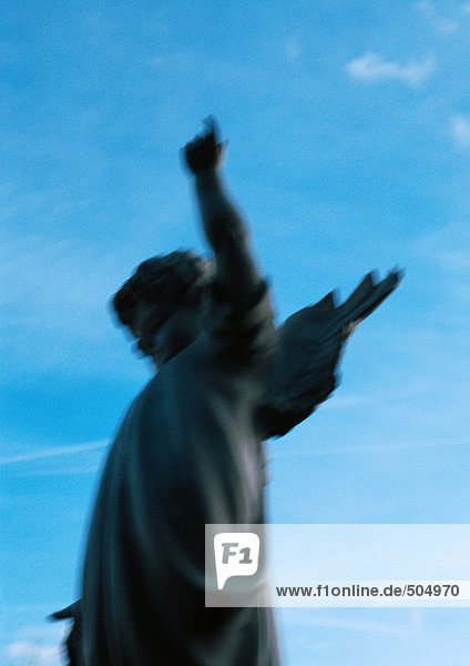 Statue  sky in background  blurred