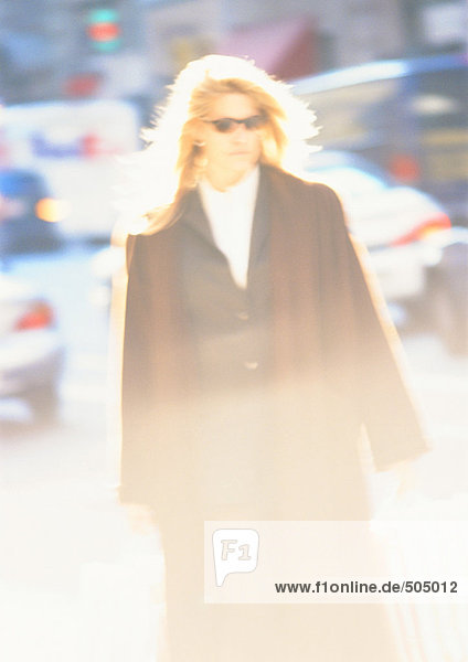 Woman in street  blurred