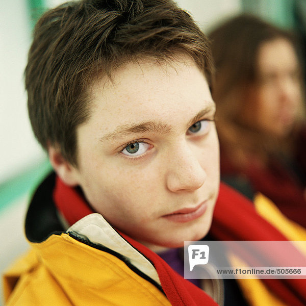 Young man looking at camera  close up portrait.