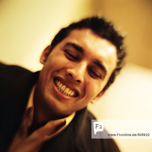 Young man smiling  close-up  portrait