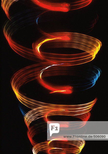 Spiralförmiger Lichteffekt  einer in dem anderen  Orangen  Rot und Blau.