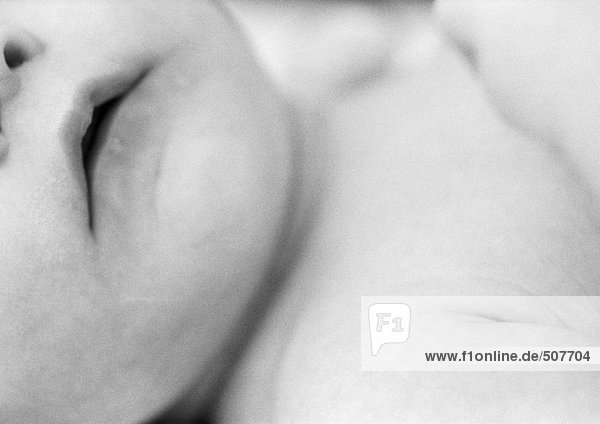 Baby's lower face and chest,  close-up,  b&w