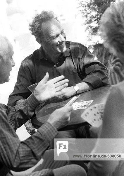 Mature adults playing cards  B&W