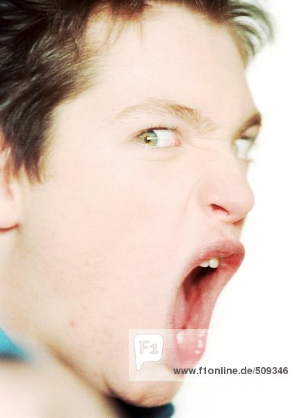 Teenage boy shouting  close-up  portrait
