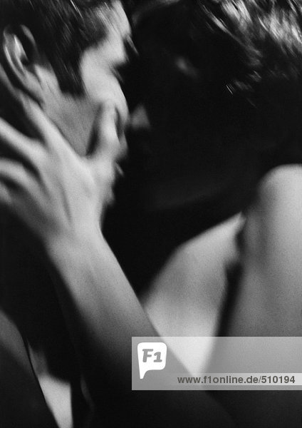 Nude couple kissing  close-up  blurred  b&w